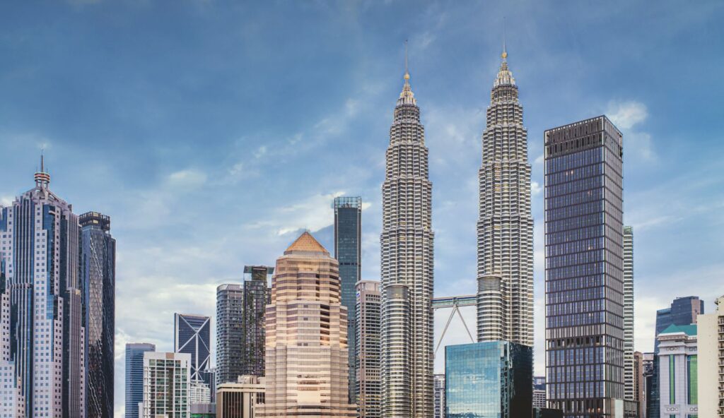 ABOVE Kuala Lumpur skyline with Four Seasons Residences next to Petronas Twin Towers (Photo: iStock)